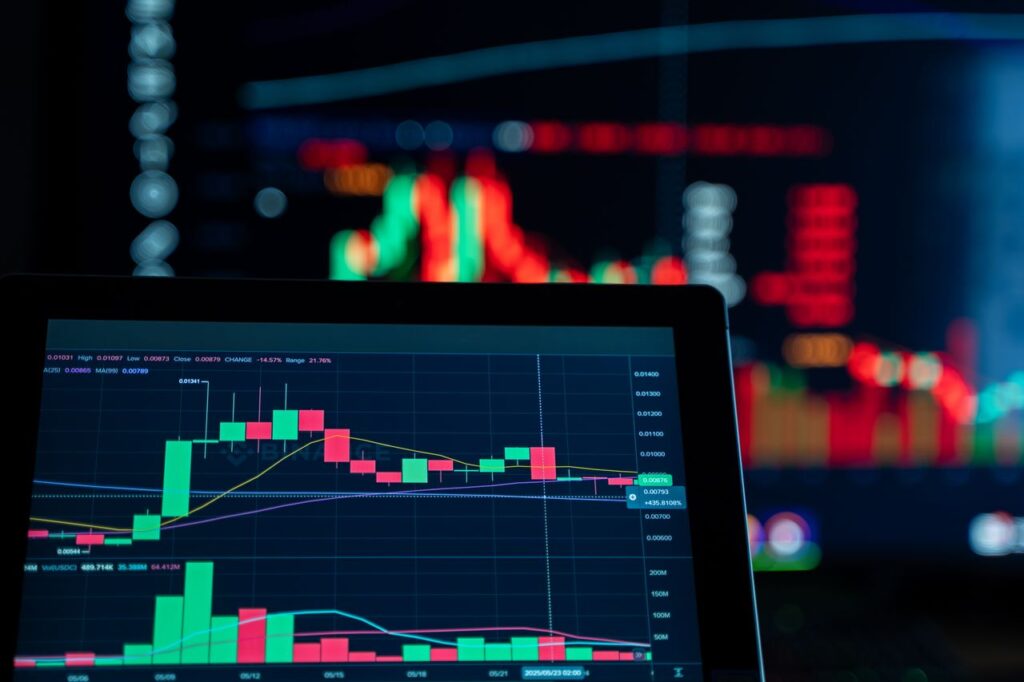 Close-up view of digital trading chart screen with vibrant graphs and data analysis.
